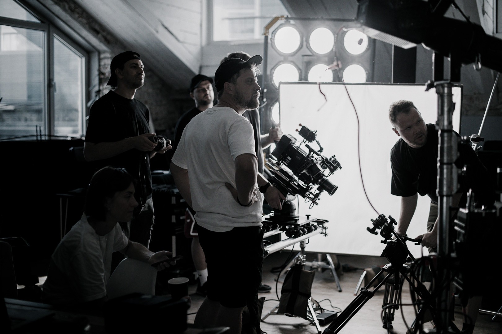 shot of a production crew on set reviewing material